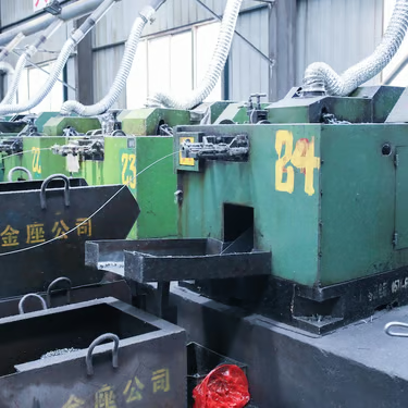 Production machines connected to overhead extraction ducts